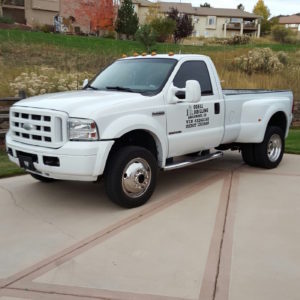 white Ford F550 support truck parked
